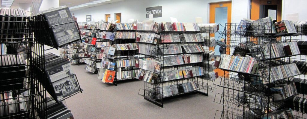 Photo of the DVD racks at a local library, DVDs available to borrow from the library