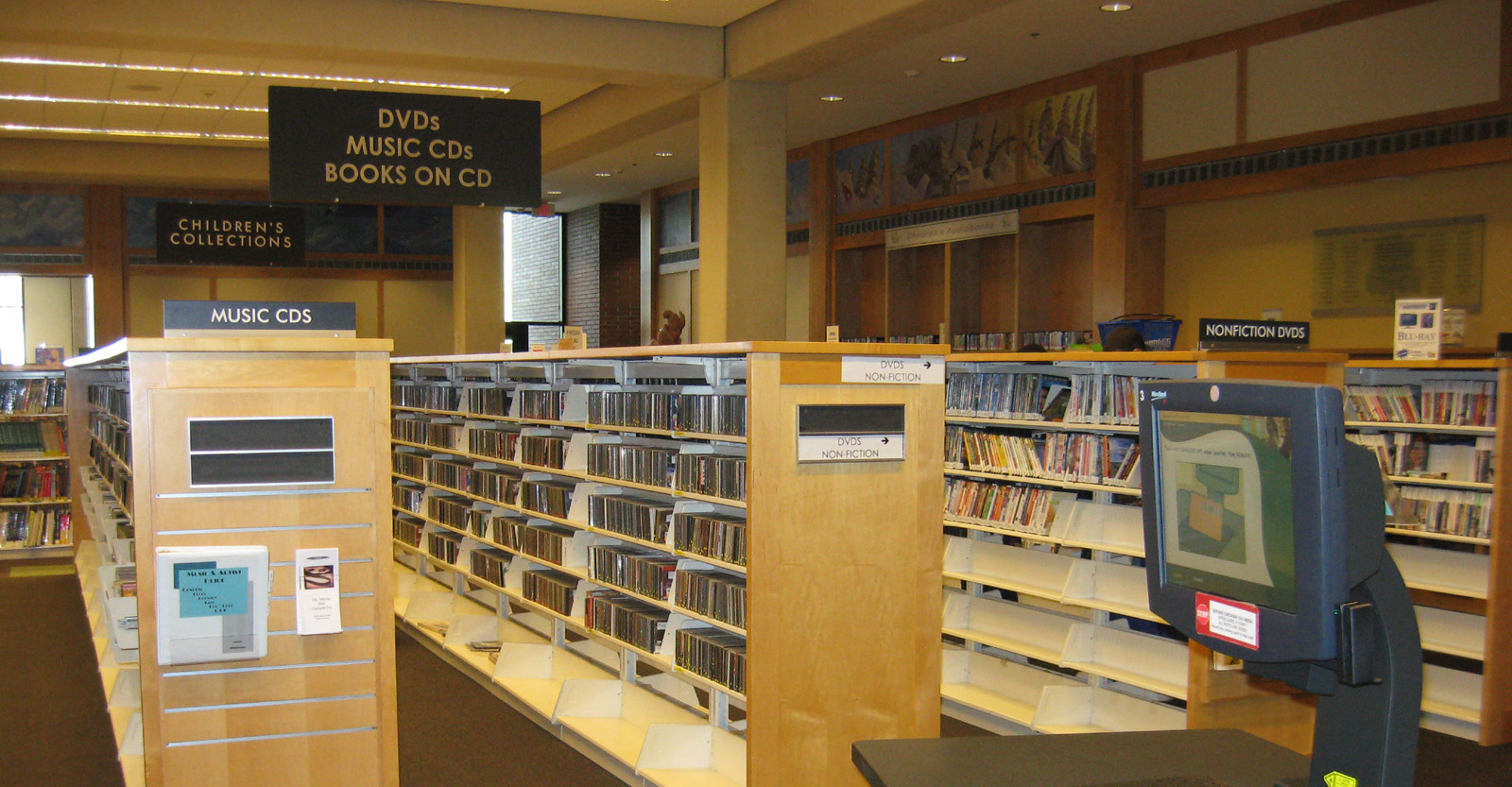 Photo showing the racks of DVD's available to rent from the library