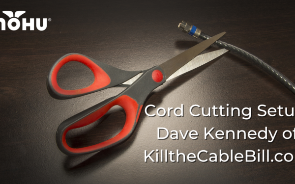 Scissors on dark background and table cutting a coaxial cable, Cord Cutting Setup Dave Kennedy of KilltheCableBill.com