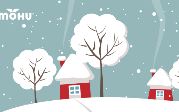 Cartoon of Winter town, snow on trees and houses with Mohu Logo
